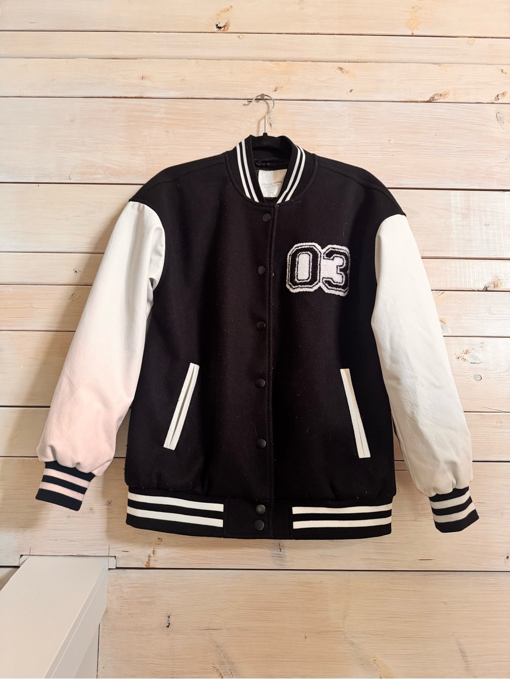 Gentle Fawn Black and White Varsity Jacket with '03' Patch